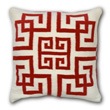 red and white geometric pillow