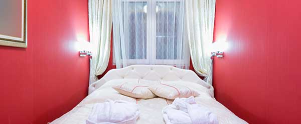 This bedroom's color is very loud for sleep and relaxation.